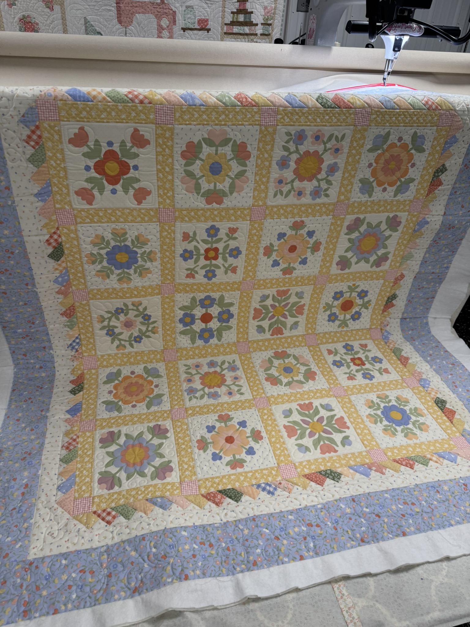 Tina’s pastel floral quilt on the longarm